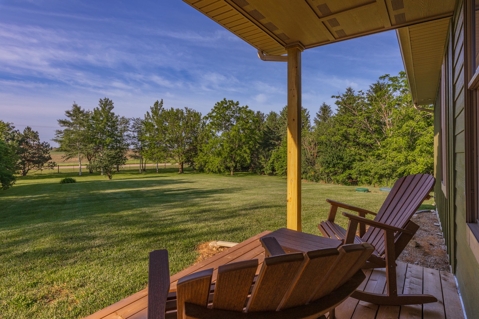 22037 East 2600 N Road Odell, IL 60460 - Photo 43 of 59 a view of a balcony with table and chairs and wooden fence