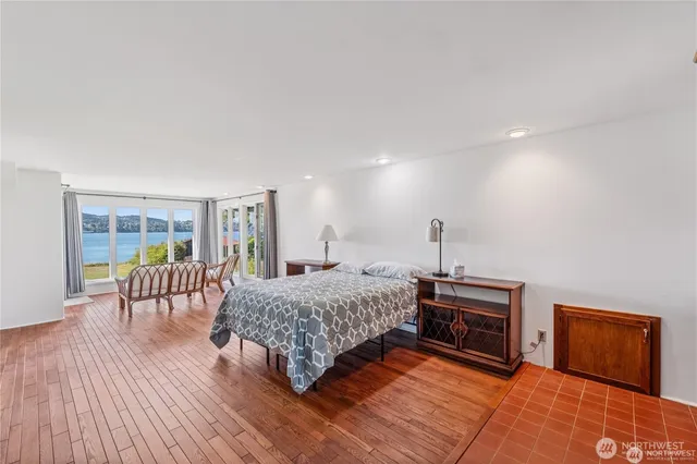 a bedroom with a bed and a table