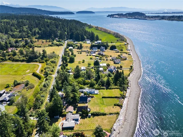 an aerial view of a house with a swimming pool