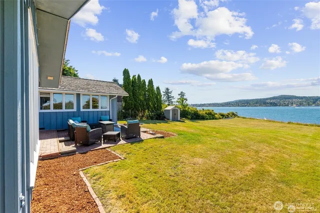 a view of a swimming pool with lounge chair
