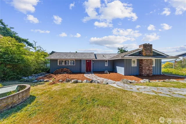 a front view of a house with a yard