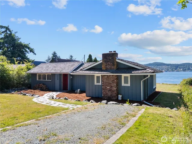 a front view of a house with a yard