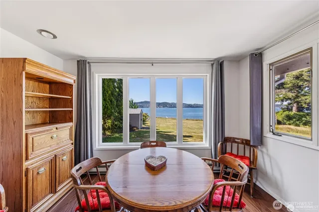 a view of a dining room with furniture window and outside view