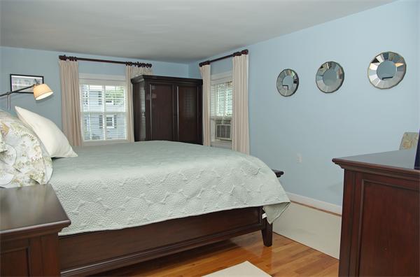 7 Westvale Road Milton, MA 02186 - Photo 6 of 14 a bedroom with a bed and cabinets