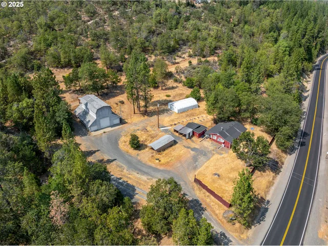 an aerial view of residential houses with outdoor space