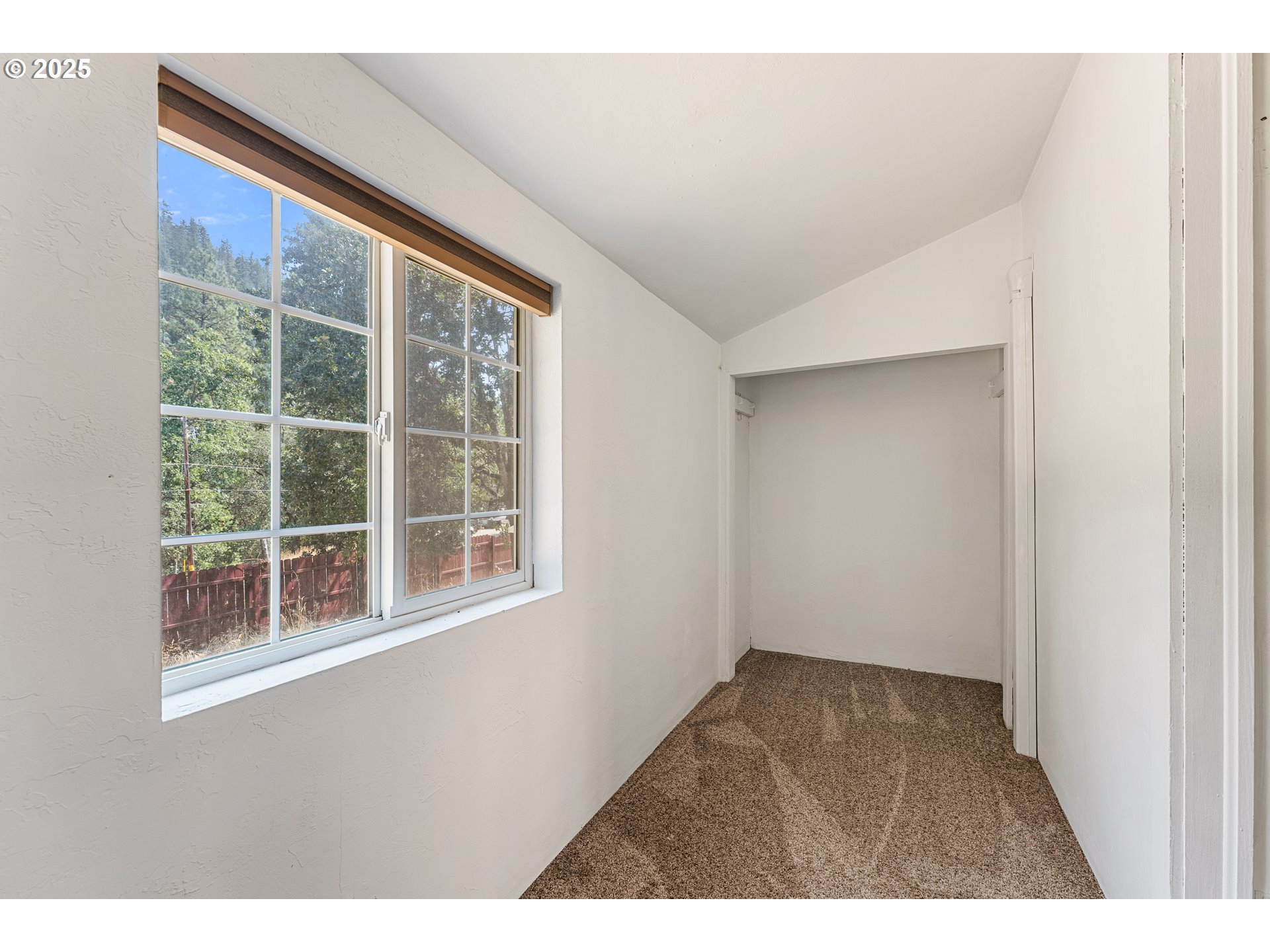3461 West Evans Creek Road Rogue River, OR 97537 - Photo 11 of 40 a view of an empty room with a window
