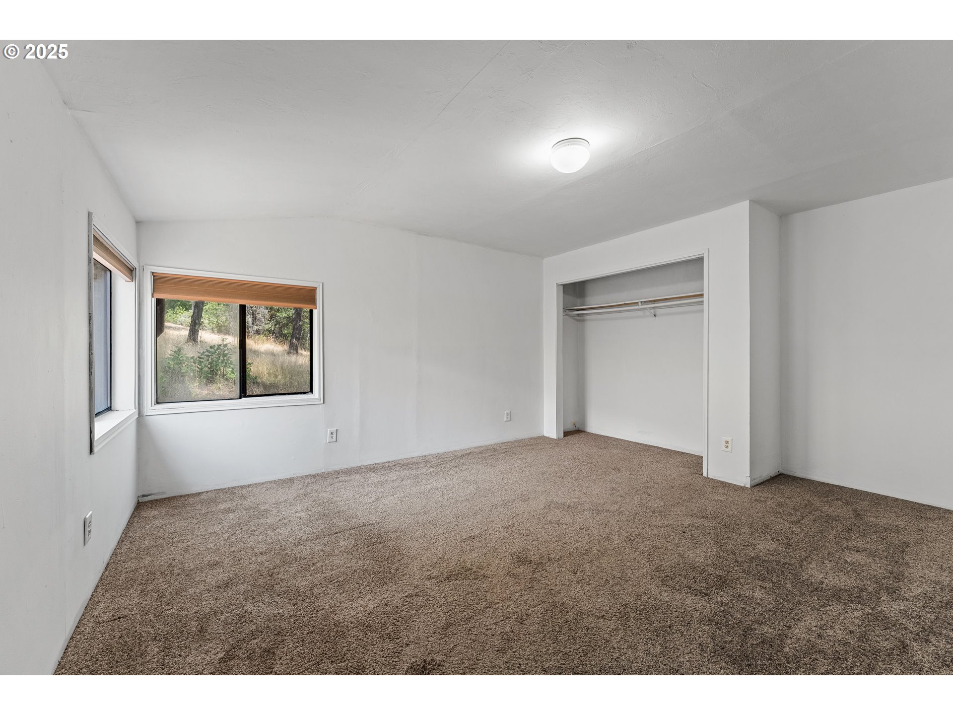 3461 West Evans Creek Road Rogue River, OR 97537 - Photo 16 of 40 a view of an empty room with a window