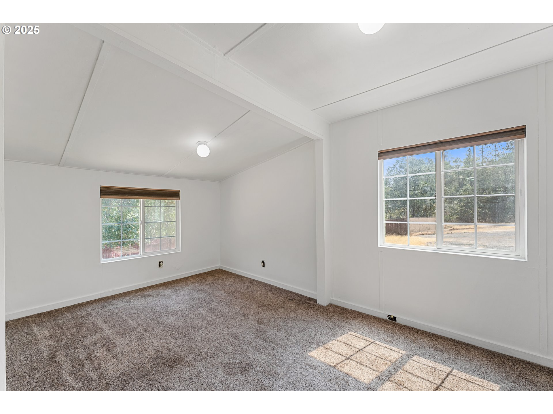 3461 West Evans Creek Road Rogue River, OR 97537 - Photo 17 of 40 a view of empty room with windows