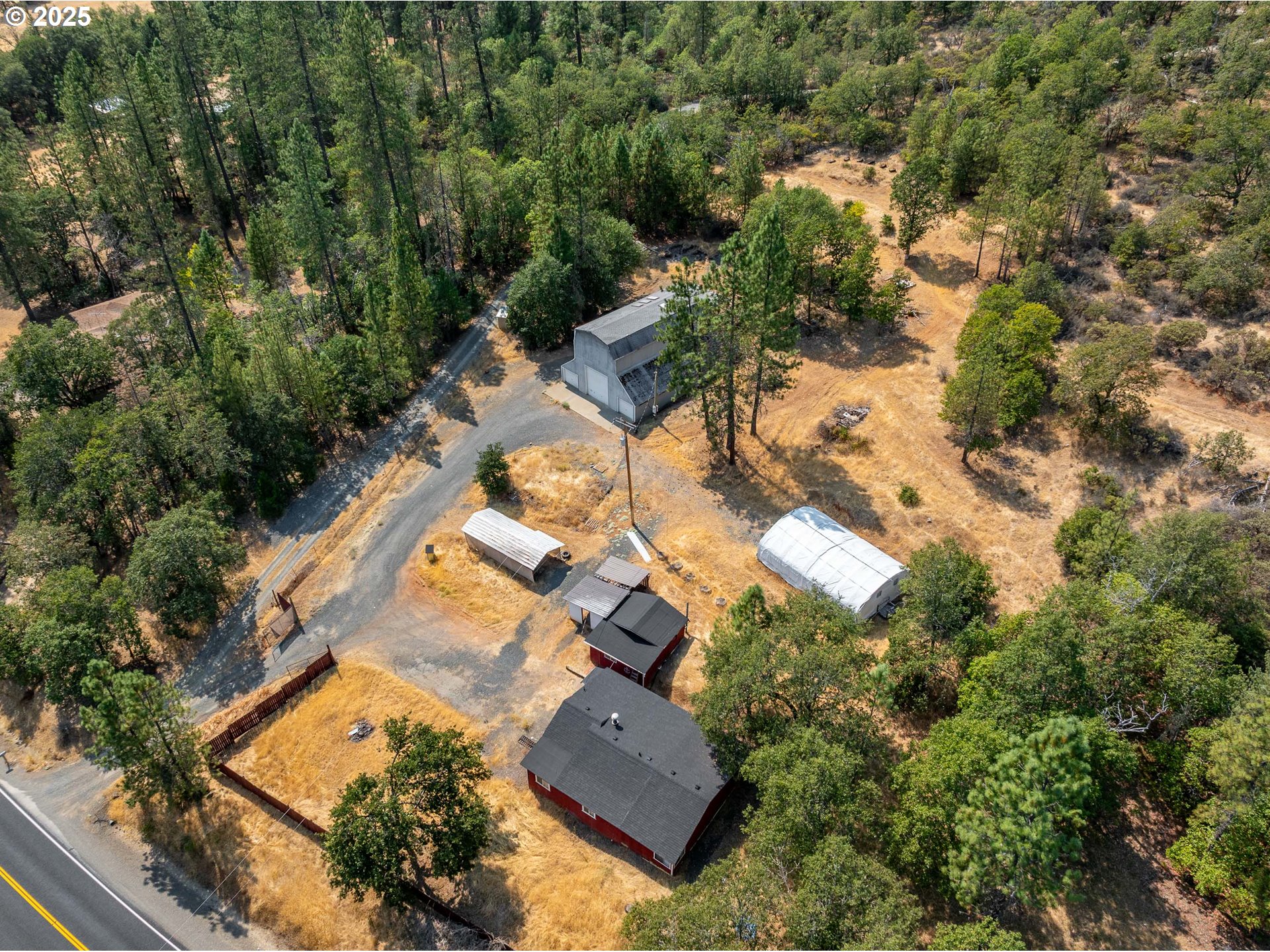 3461 West Evans Creek Road Rogue River, OR 97537 - Photo 35 of 40 an aerial view of residential houses with outdoor space