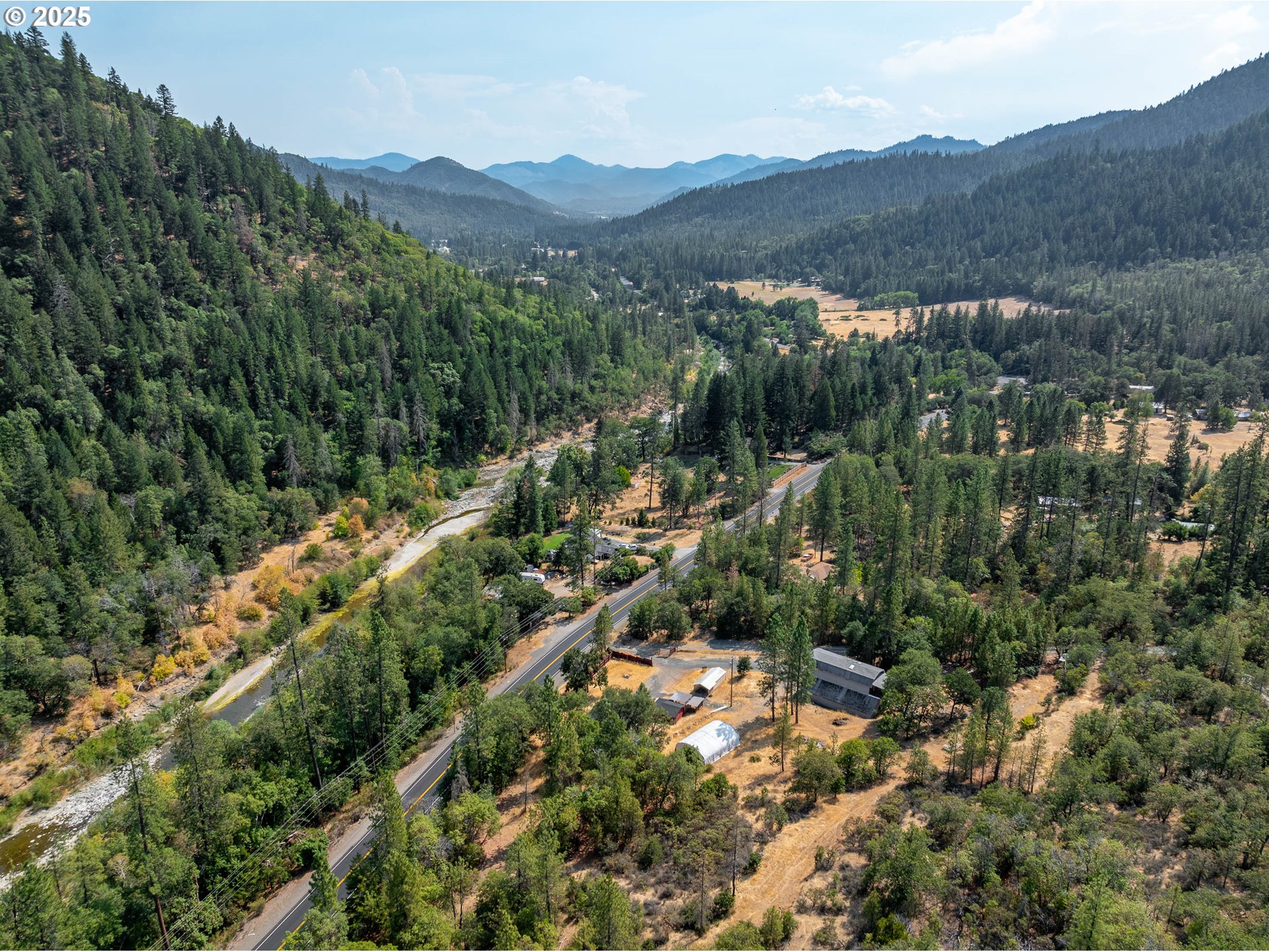 3461 West Evans Creek Road Rogue River, OR 97537 - Photo 36 of 40 an aerial view of mountains residential house and green space