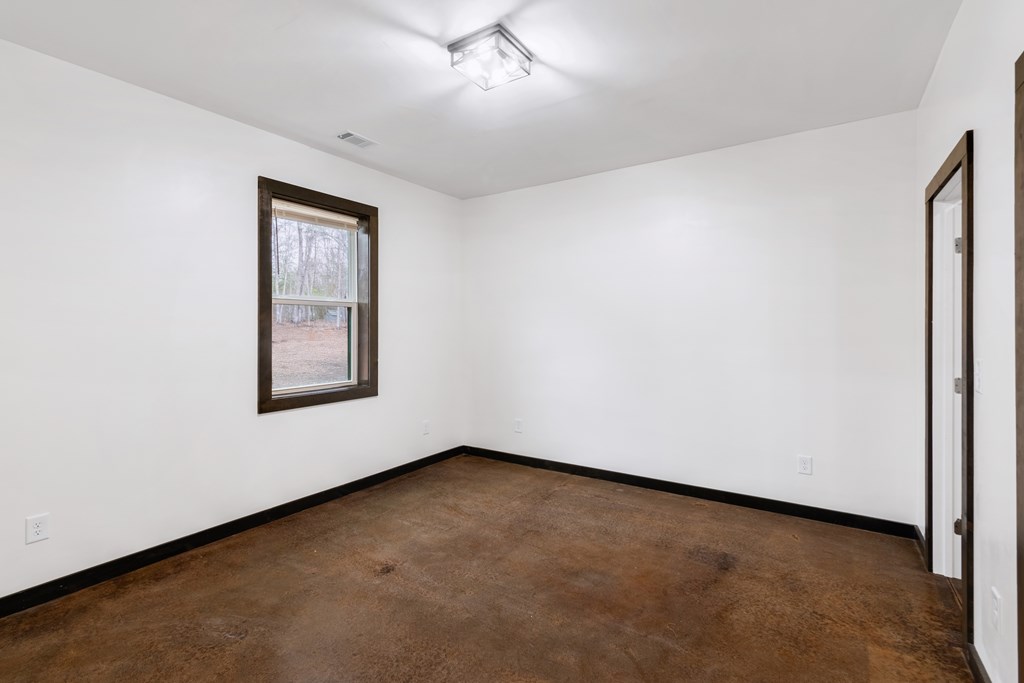 137 A Johnson Ford Road Epworth, GA 30541 - Photo 14 of 21 an empty room with a window