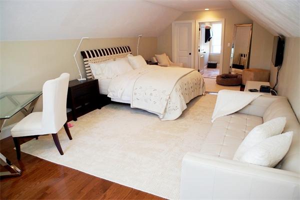 39 Thurston Lane Needham, MA 02492 - Photo 27 of 30 a spacious bedroom with a bed and a chair