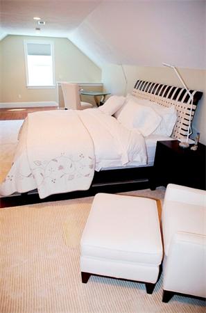 39 Thurston Lane Needham, MA 02492 - Photo 28 of 30 a bedroom with a bed and a night stand