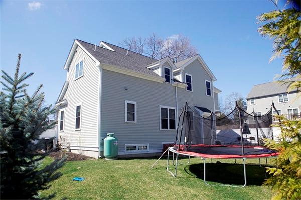 39 Thurston Lane Needham, MA 02492 - Photo 6 of 30 a front view of house with yard and outdoor seating