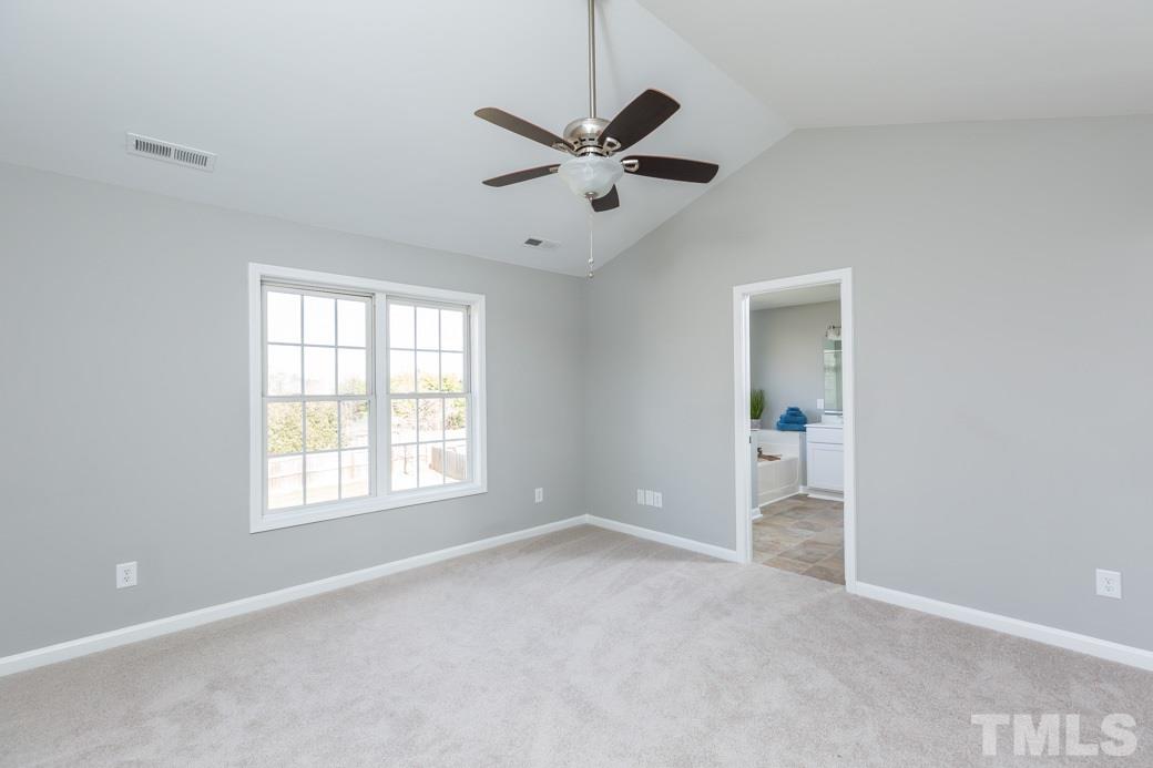 232 Seastone Street Raleigh, NC 27603 - Photo 12 of 20 a view of an empty room with a window