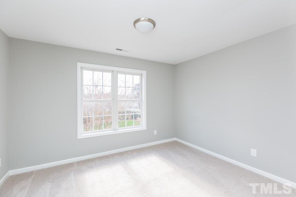 232 Seastone Street Raleigh, NC 27603 - Photo 14 of 20 an empty room with a window