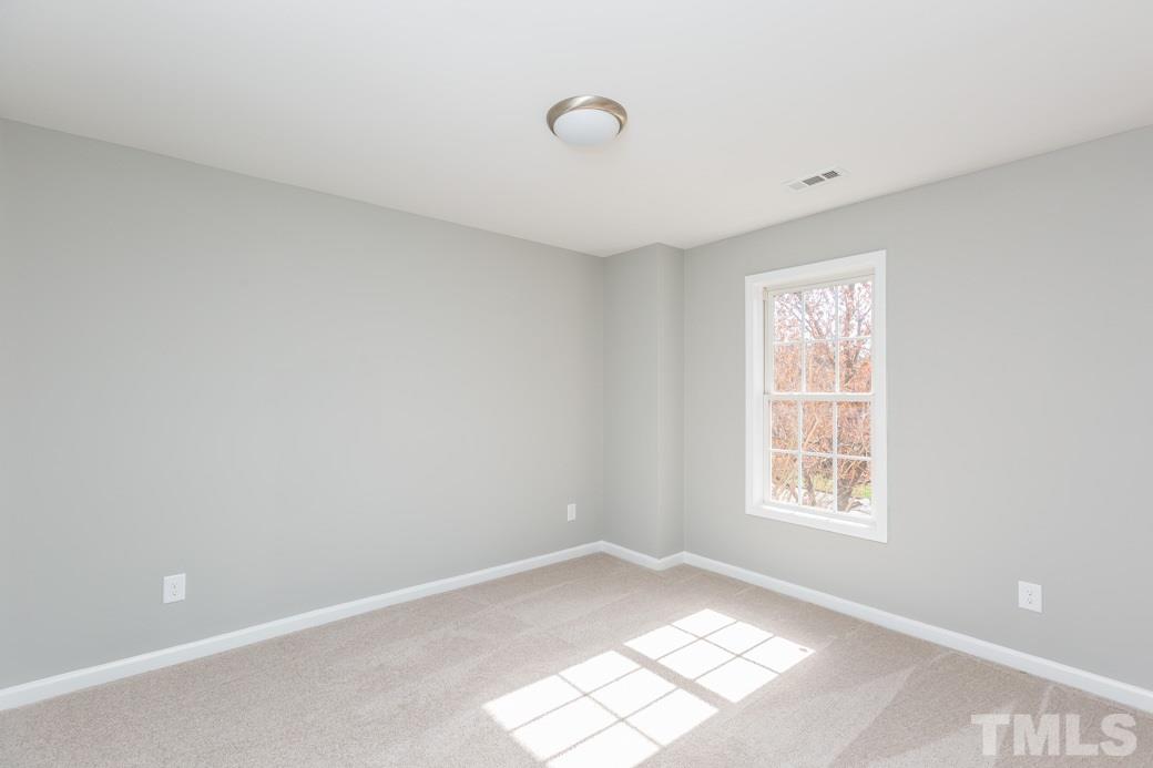 232 Seastone Street Raleigh, NC 27603 - Photo 15 of 20 an empty room with windows