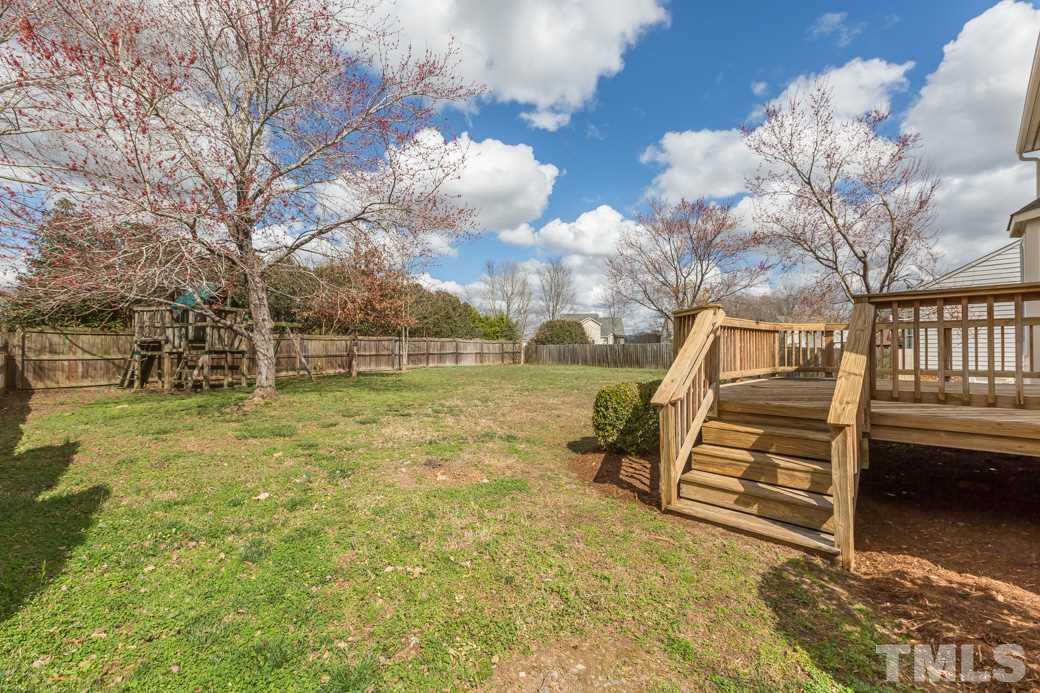 232 Seastone Street Raleigh, NC 27603 - Photo 19 of 20 a view of a yard with wooden fence