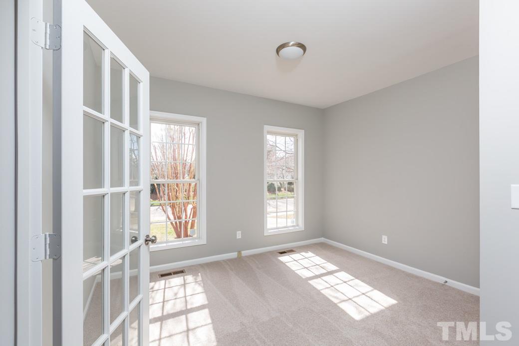 232 Seastone Street Raleigh, NC 27603 - Photo 4 of 20 a view of an empty room with a window