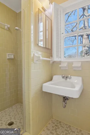 a bathroom with a sink and a window
