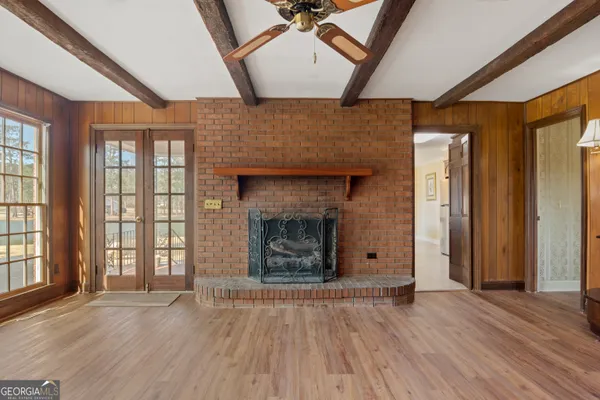 a view of a porch with wooden floor
