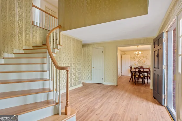 a view of a house with large space and windows