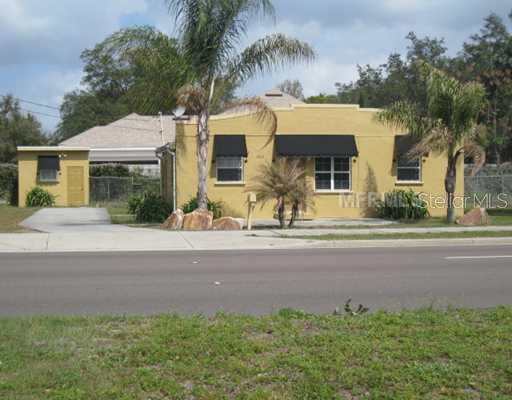 7000 Red Bug Lake Road Oviedo, FL 32765 - Photo 1 of 1 front view of house with a yard and palm trees