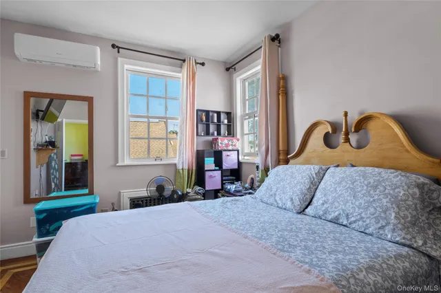 a bedroom with bed and a window