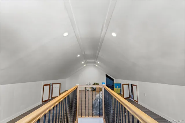 a view of a hallway with staircase