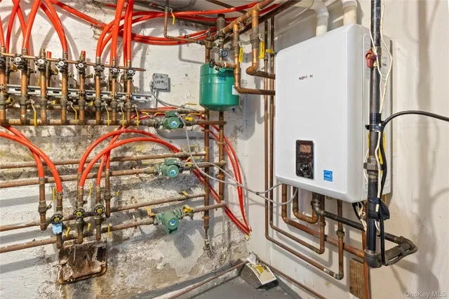 a view of storage and utility room with a sink