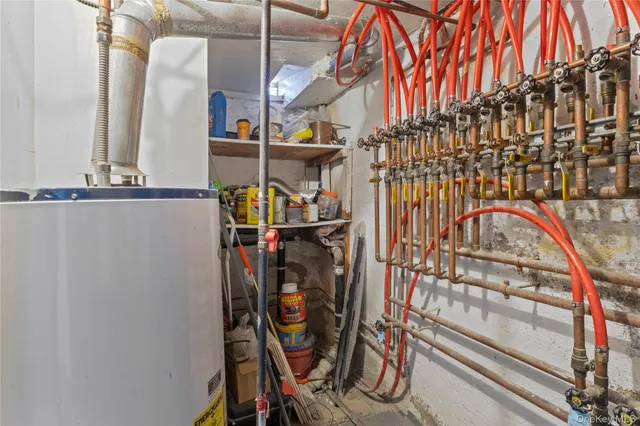 an empty room with stairs and windows