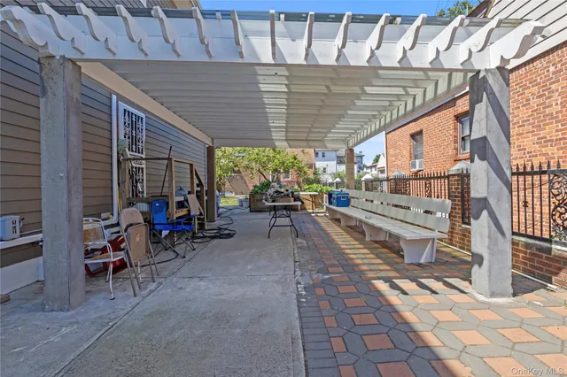 a picture of a bench in front of a gate