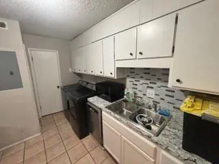 a kitchen with a stove and a refrigerator