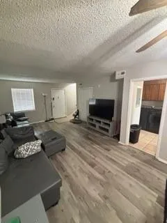 a living room with furniture and a flat screen tv