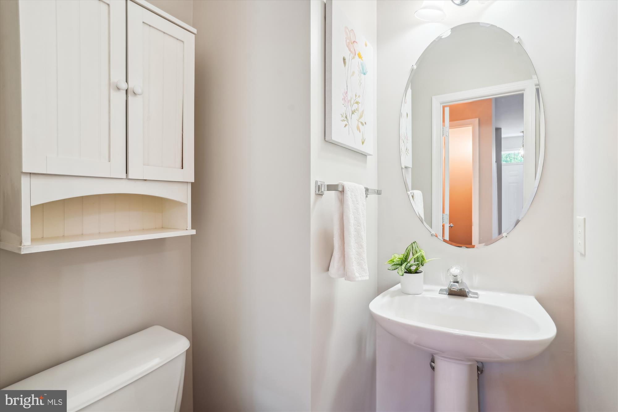 4158 Ashmere Circle Dumfries, VA 22025 - Photo 10 of 28 a bathroom with a sink and a mirror