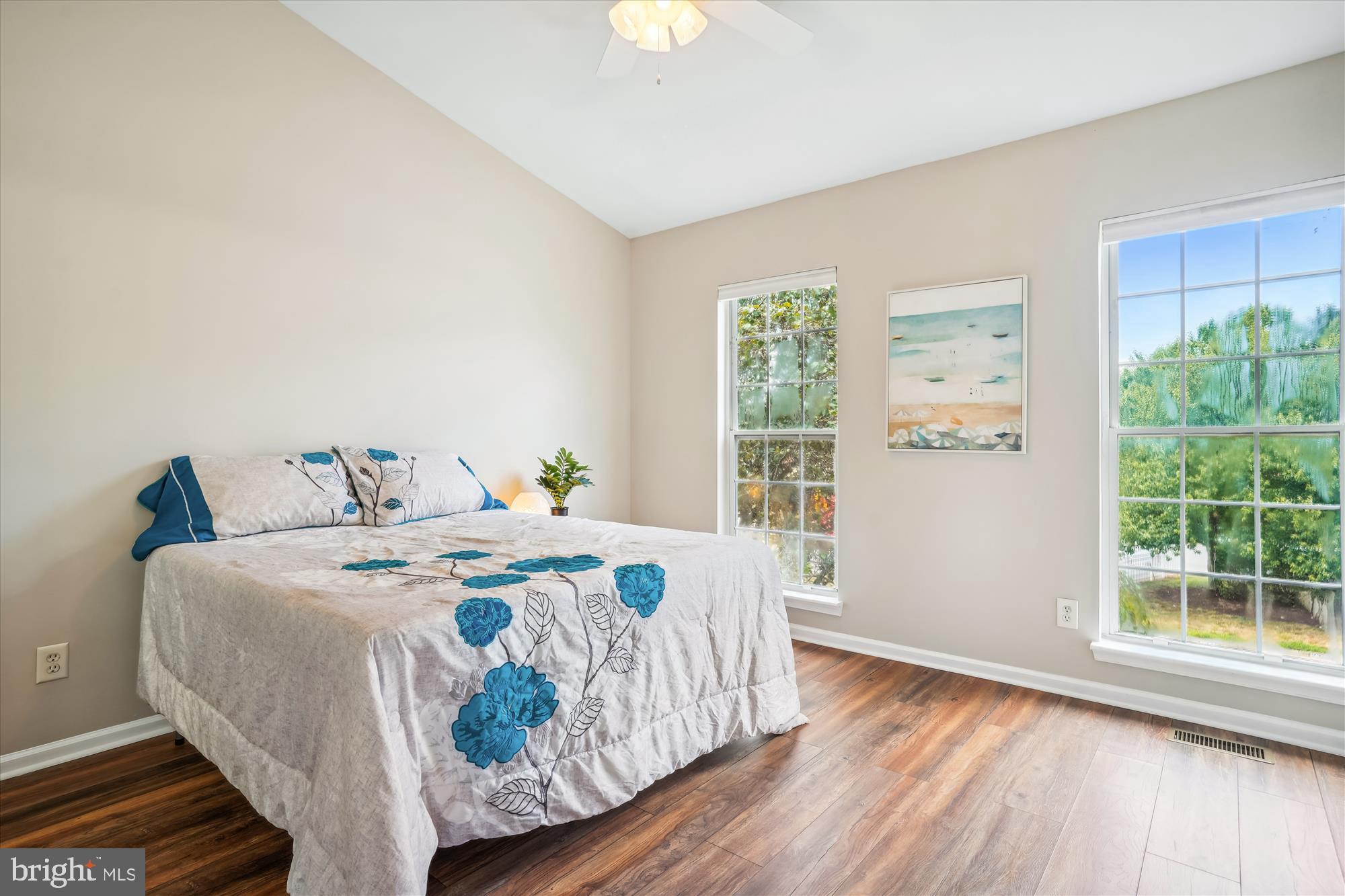 4158 Ashmere Circle Dumfries, VA 22025 - Photo 13 of 28 a bed sitting in a bedroom next to a window