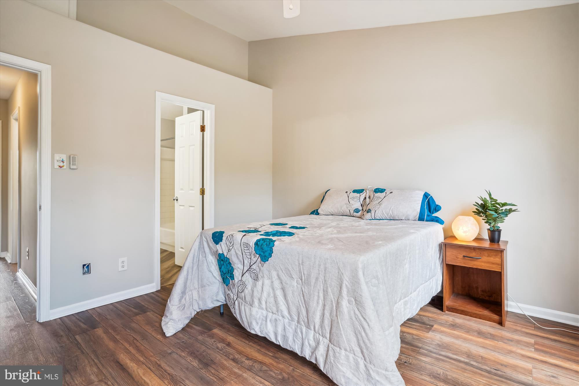 4158 Ashmere Circle Dumfries, VA 22025 - Photo 14 of 28 a bedroom with a bed and a wooden floor