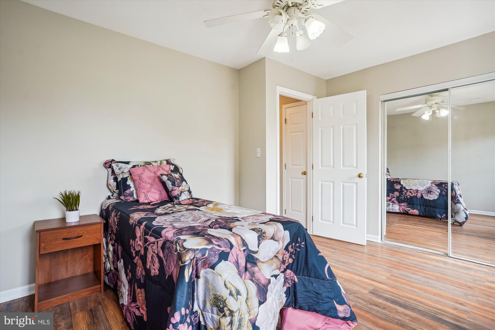 4158 Ashmere Circle Dumfries, VA 22025 - Photo 15 of 28 a bedroom with a bed and wooden floor