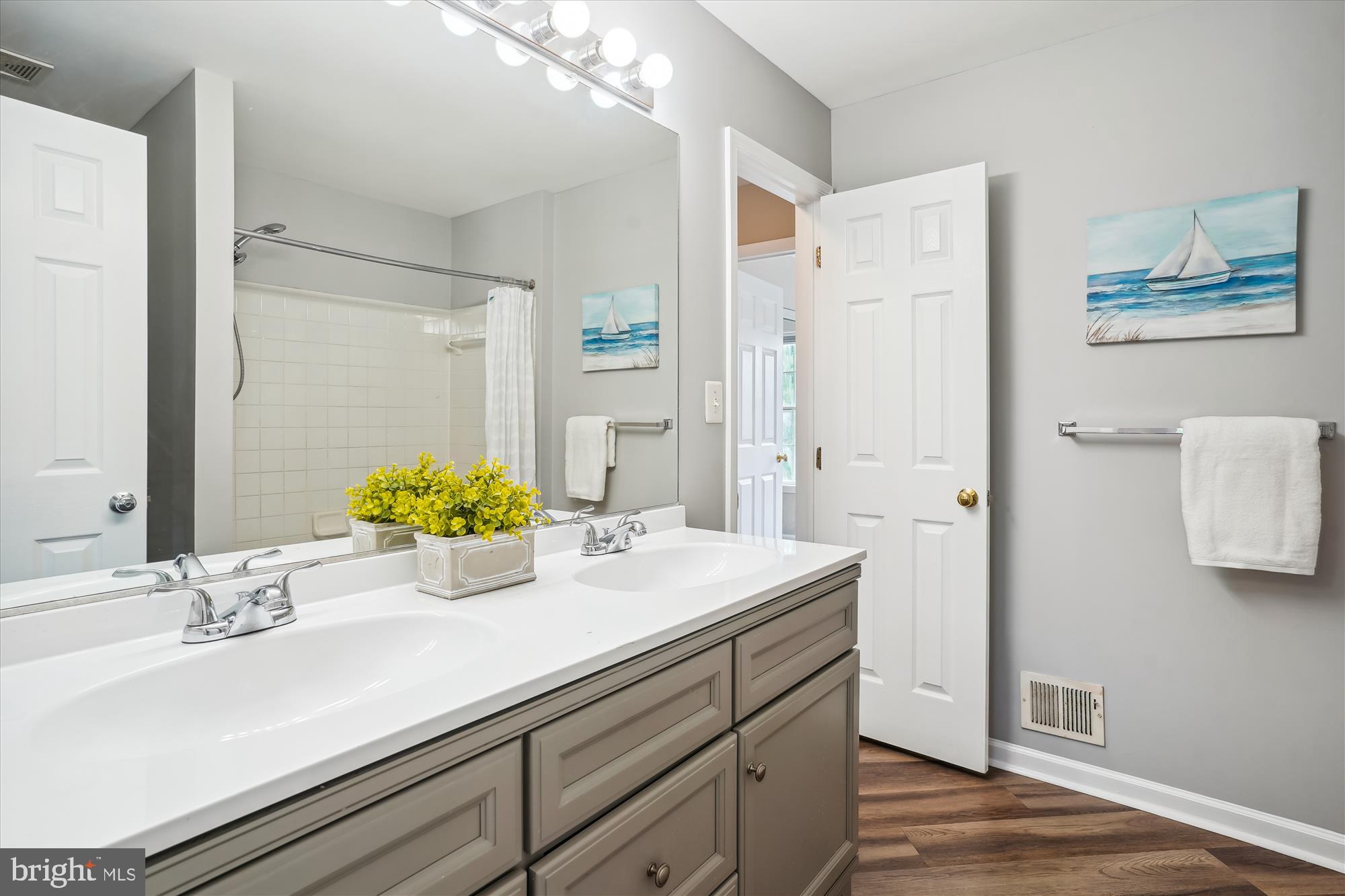 4158 Ashmere Circle Dumfries, VA 22025 - Photo 17 of 28 a bathroom with a sink and a mirror