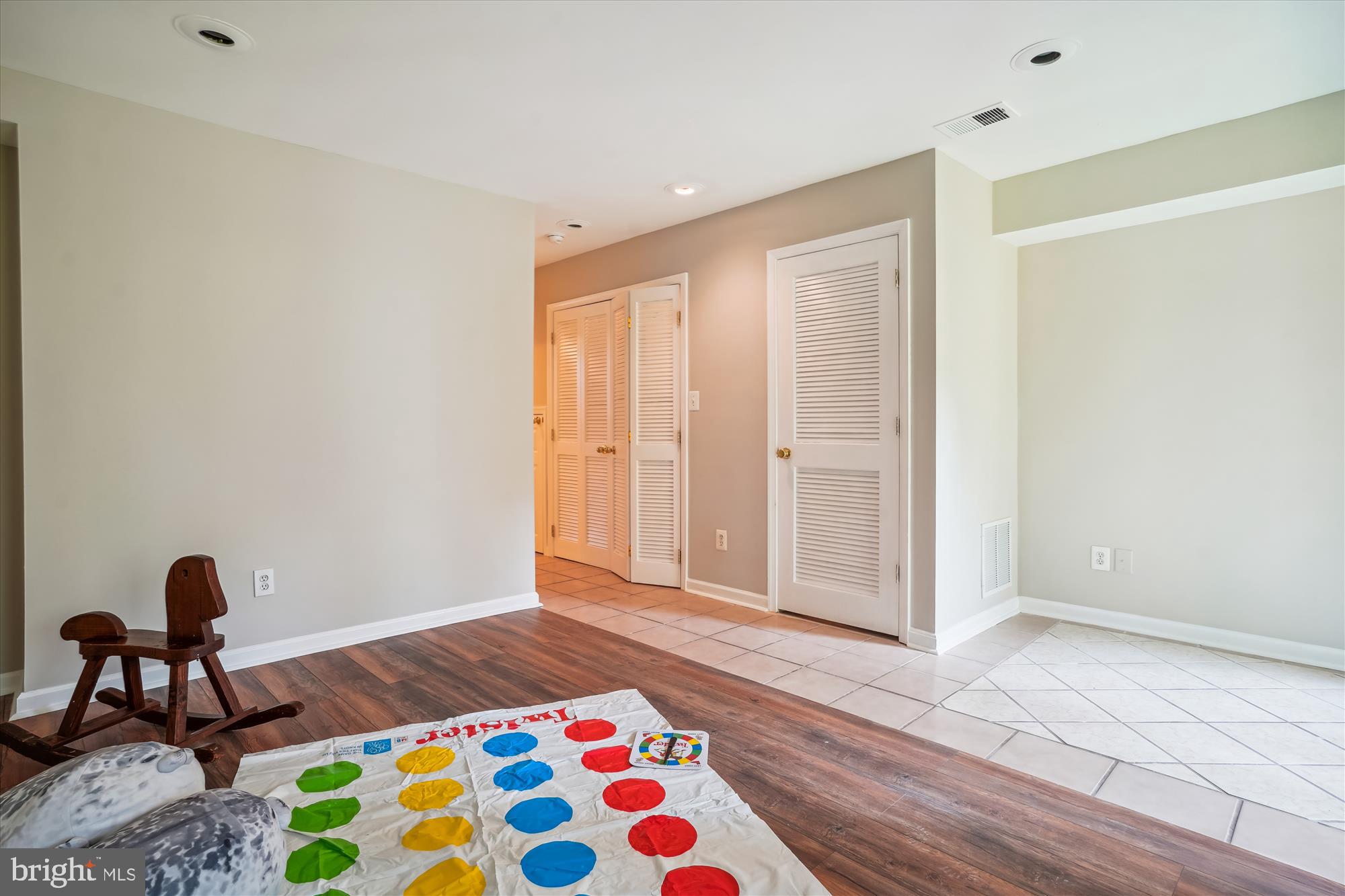 4158 Ashmere Circle Dumfries, VA 22025 - Photo 22 of 28 a bedroom with a bed and a chandelier