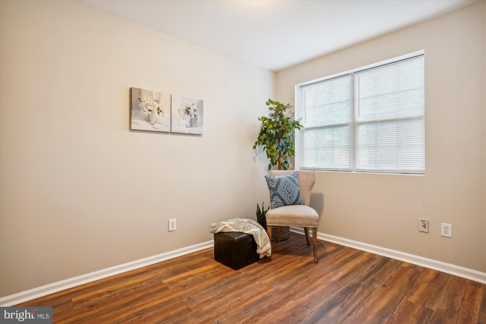 4158 Ashmere Circle Dumfries, VA 22025 - Photo 23 of 28 a room with a window and wooden floor