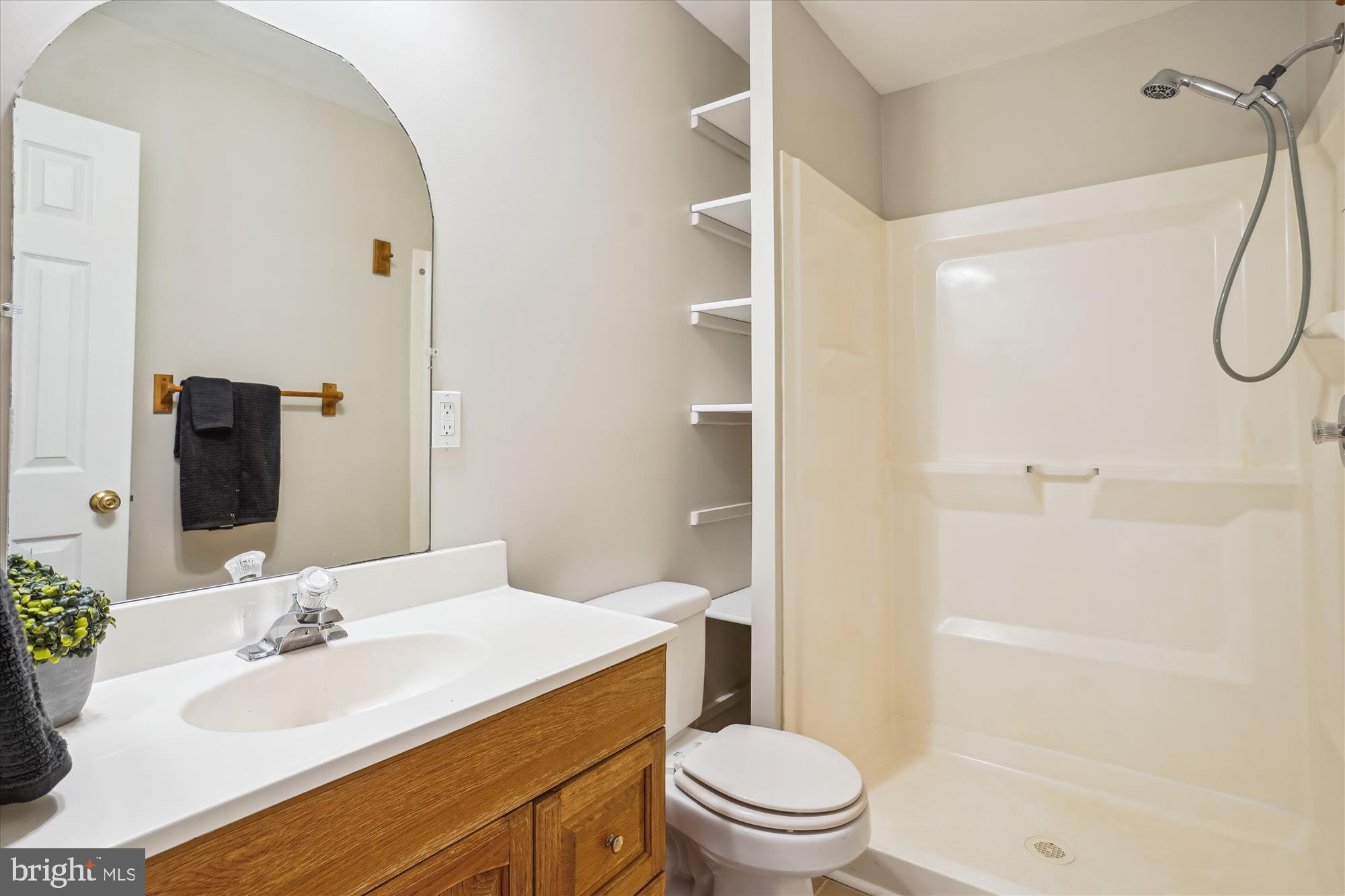 4158 Ashmere Circle Dumfries, VA 22025 - Photo 24 of 28 a bathroom with a sink a toilet and shower