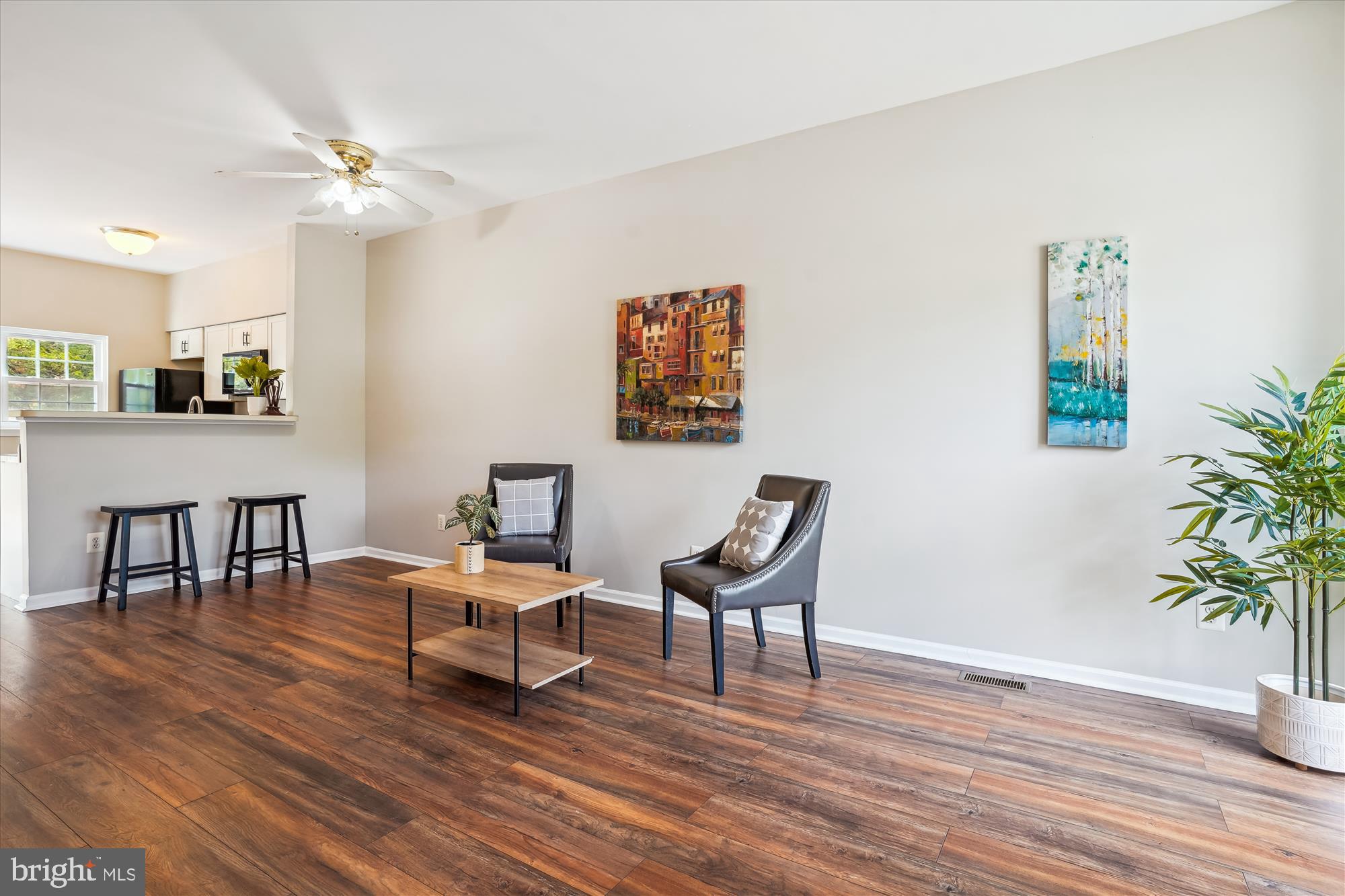4158 Ashmere Circle Dumfries, VA 22025 - Photo 28 of 28 a living room with furniture and a wooden floor