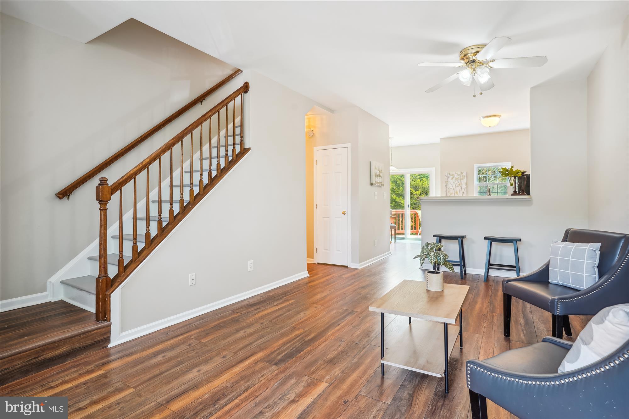 4158 Ashmere Circle Dumfries, VA 22025 - Photo 5 of 28 a view of a livingroom with furniture a ceiling fan and wooden floor