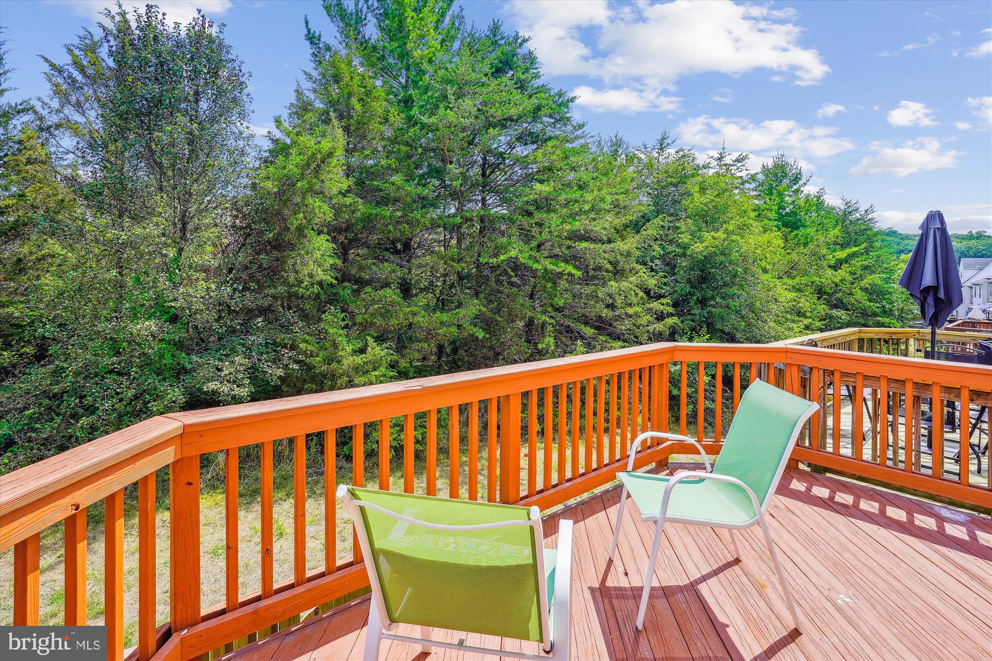 4158 Ashmere Circle Dumfries, VA 22025 - Photo 9 of 28 a balcony with wooden floor and trees in the background