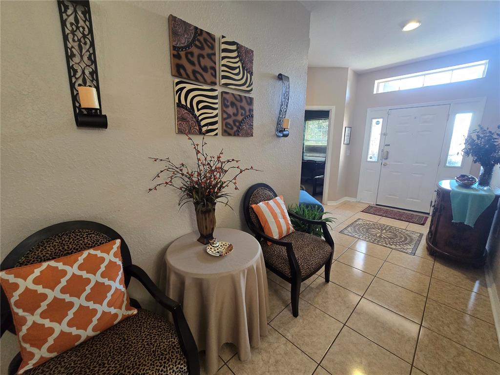 219 Cloverdale Road Winter Haven, FL 33884 - Photo 3 of 29 a view of livingroom with furniture and entryway