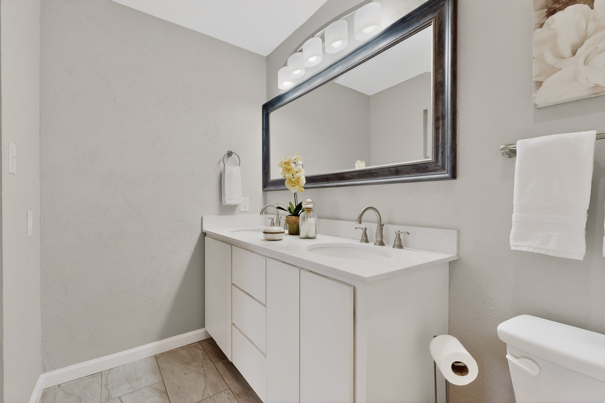 7200 Barnsdale Way Austin, TX 78745 - Photo 15 of 26 a bathroom with a toilet sink and mirror