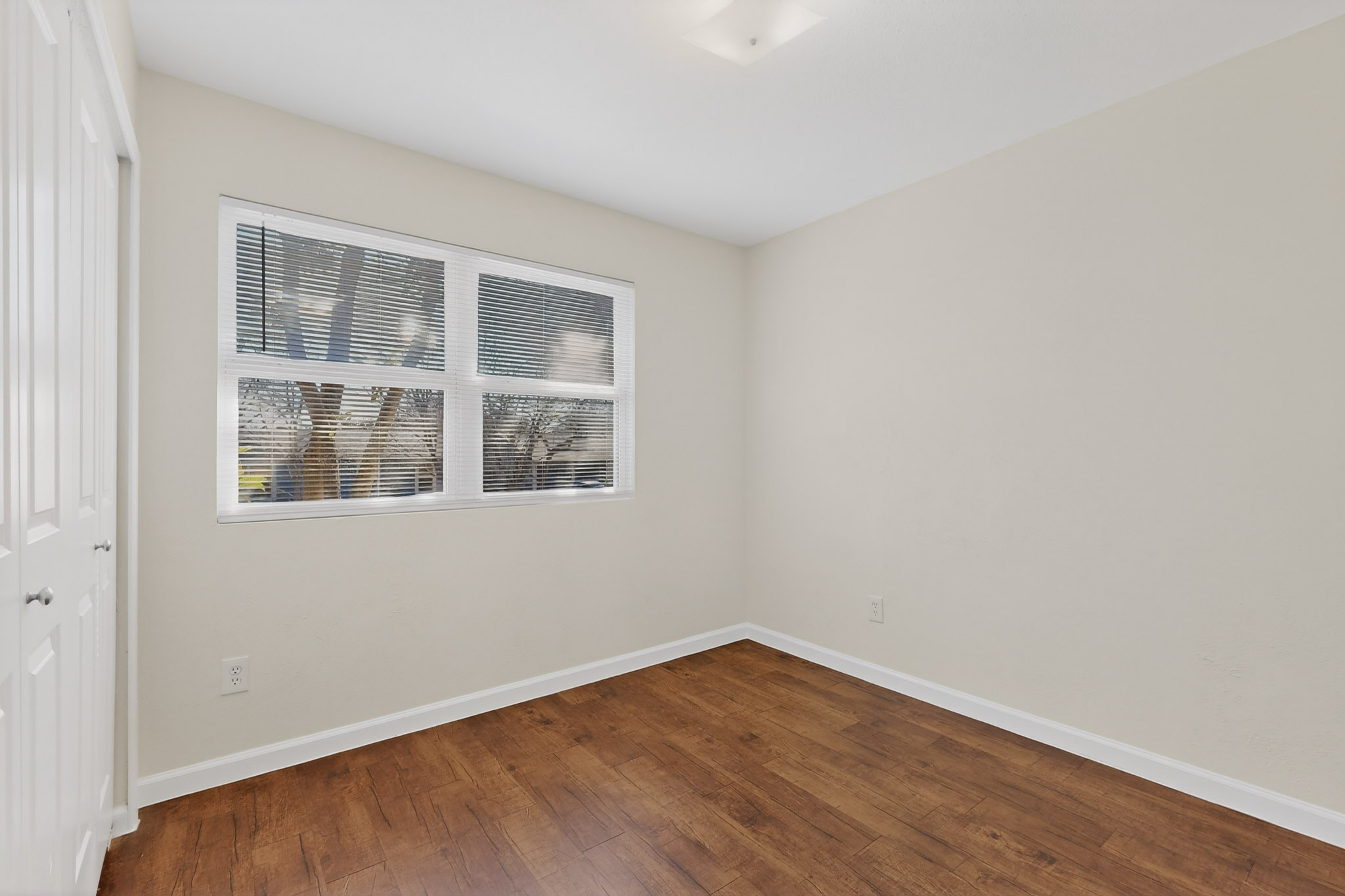 7200 Barnsdale Way Austin, TX 78745 - Photo 18 of 26 a view of empty room with wooden floor and fan