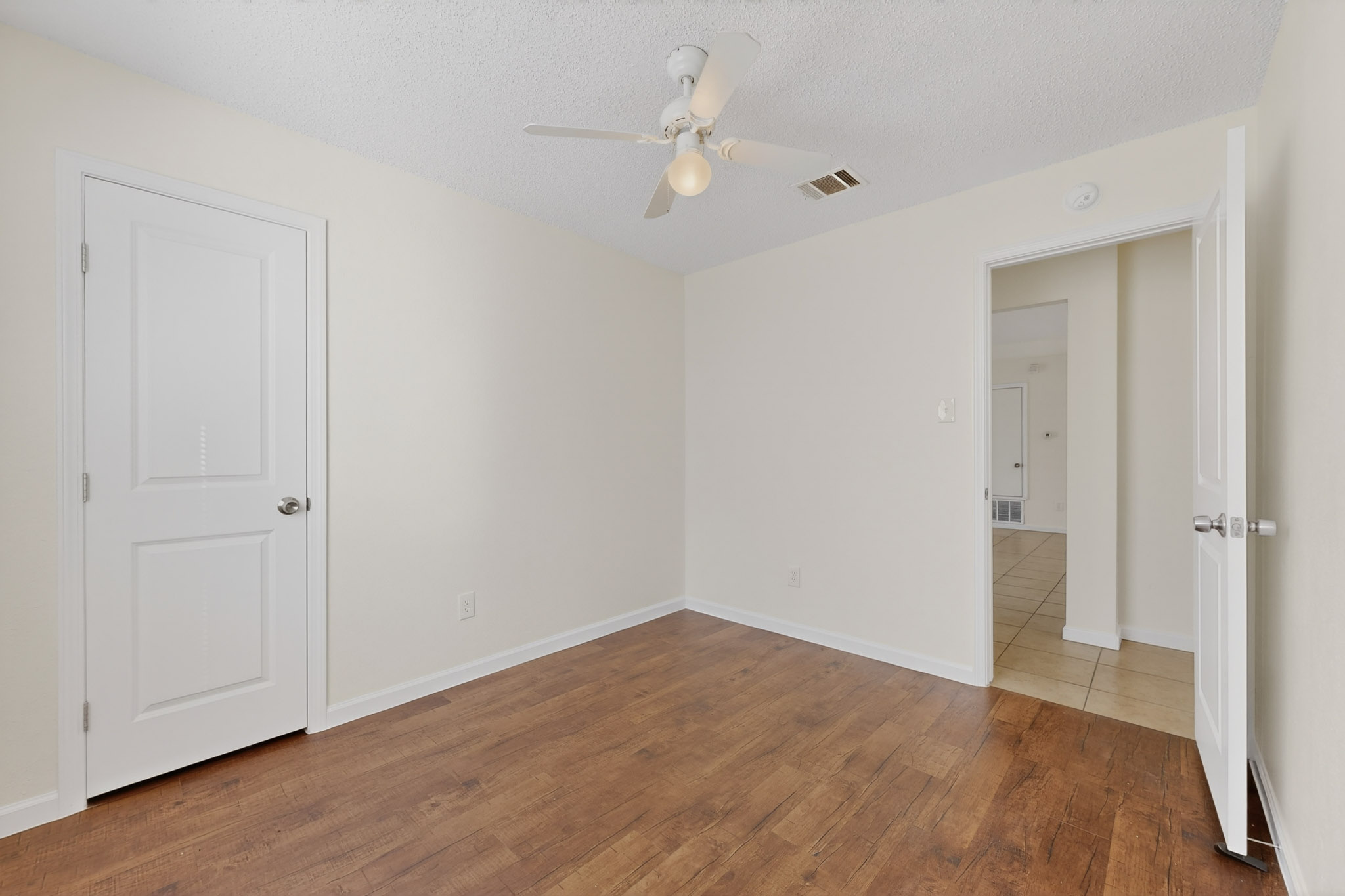 7200 Barnsdale Way Austin, TX 78745 - Photo 22 of 26 a view of an empty room with wooden floor