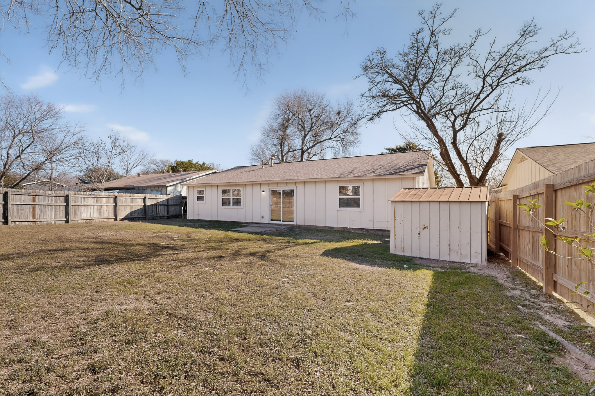 7200 Barnsdale Way Austin, TX 78745 - Photo 25 of 26 a view of a white house with a large tree in front of it